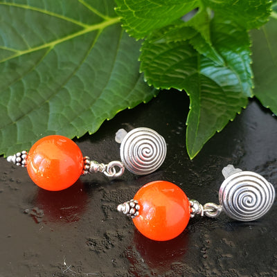 Orange Jade and sterling silver swirl earrings