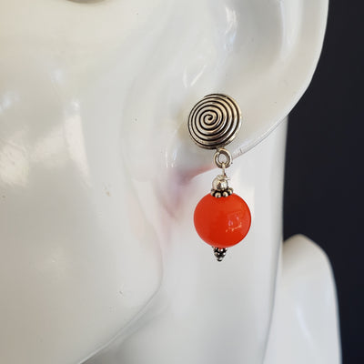 Orange Jade and sterling silver swirl earrings