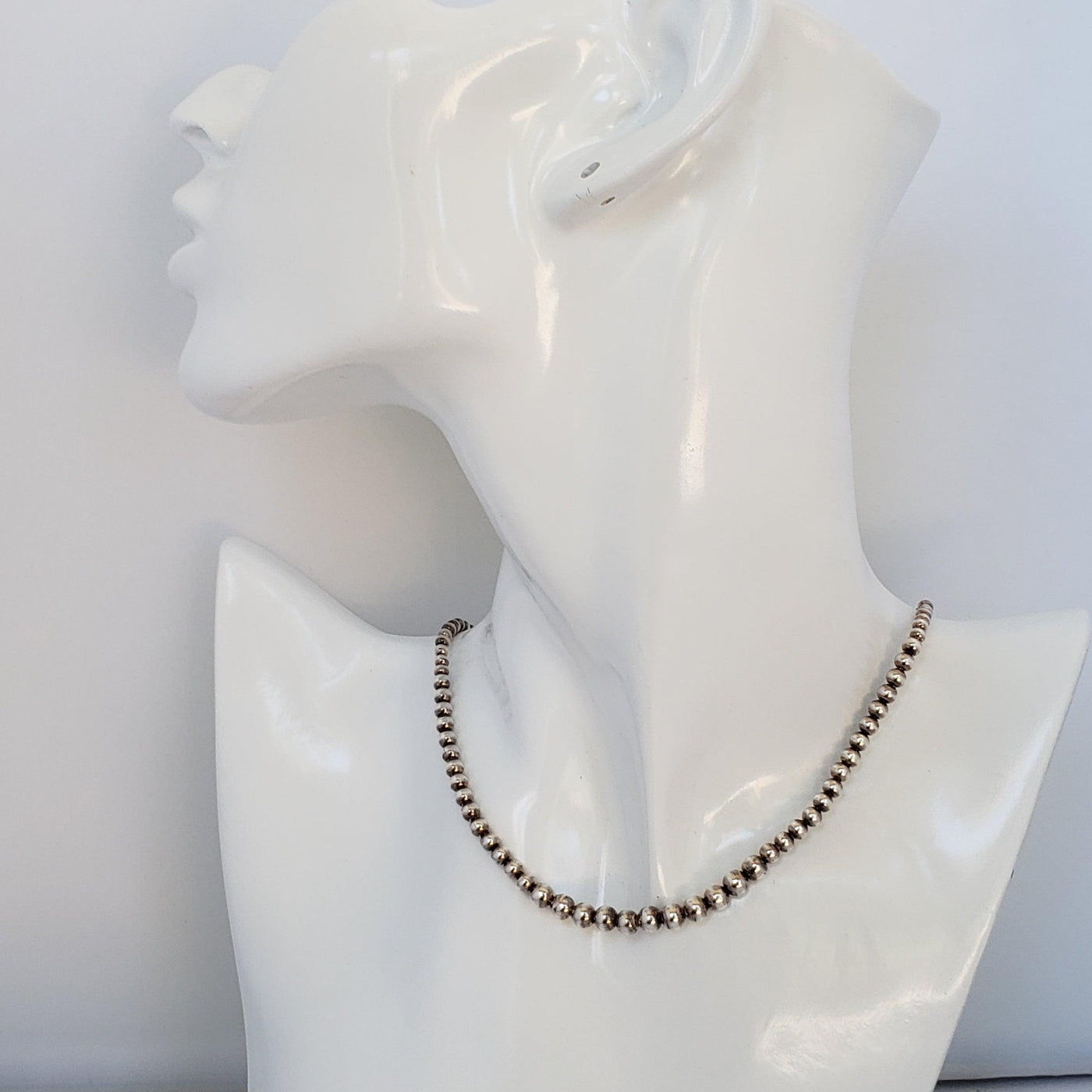 Graduated silver bead necklace